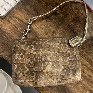 Gold coach wristlet. Used